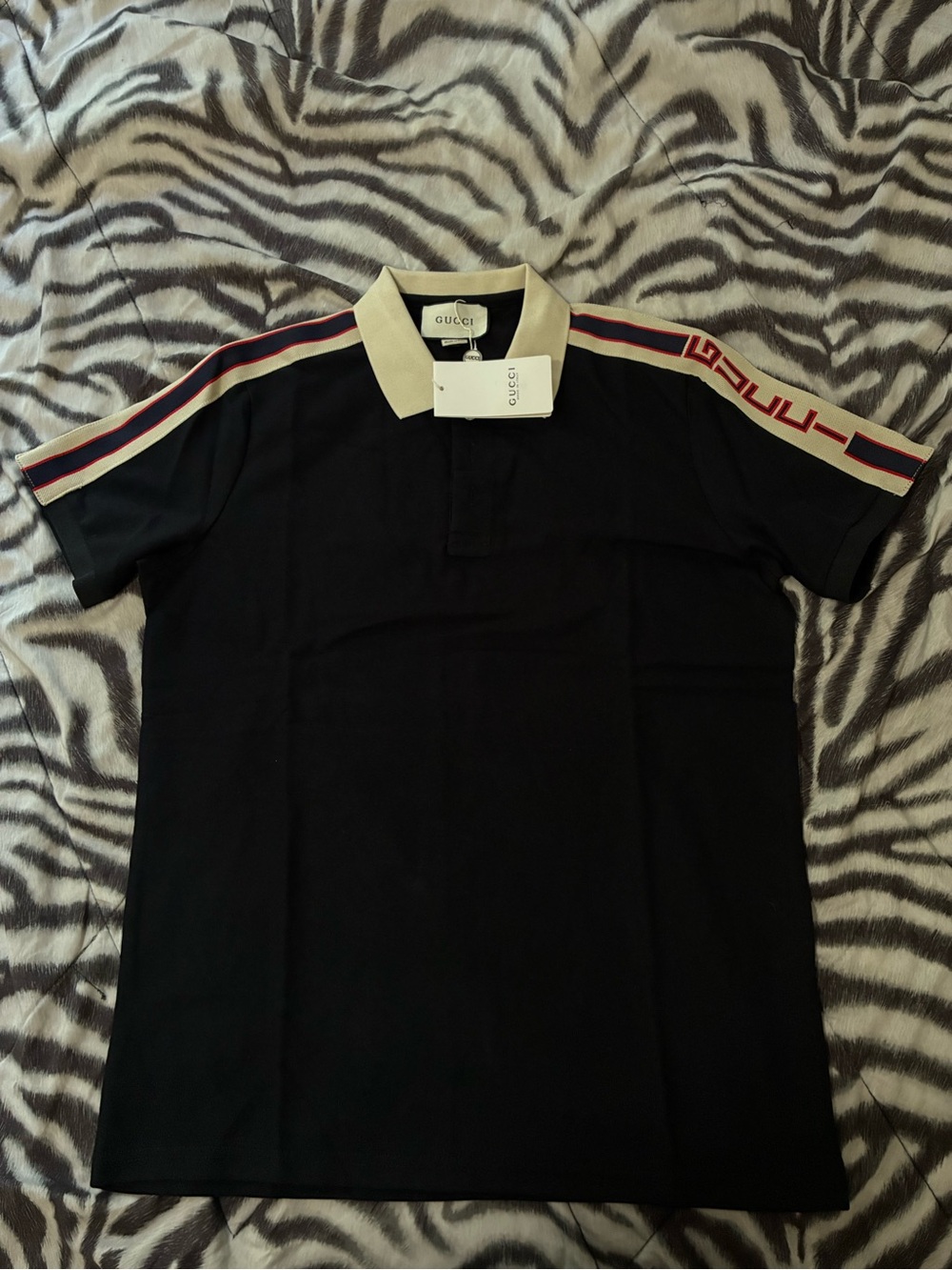 Black Polo with Cream Collar and Red-Blue Shoulder Stripes